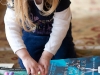 Chloe Arranging her Books