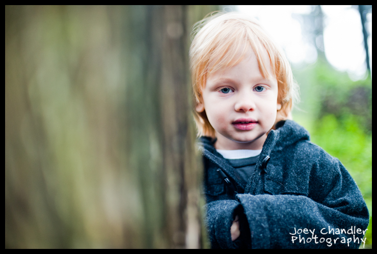 Red-Hair-Boy-peaking-behind-tree-in-the-Presidio-San-Francisco