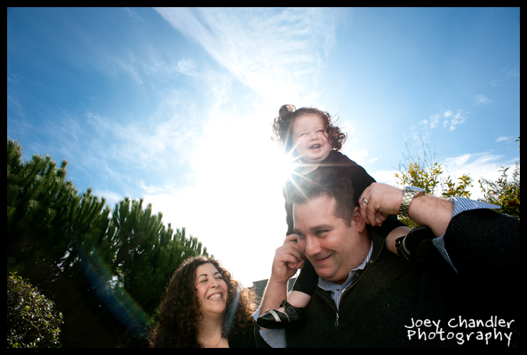 Sun Flare with the Fox Family - San Francisco Baby Photographer BAby girl on Dad's shoulders with a sun flare - San Francisco Baby Photographer