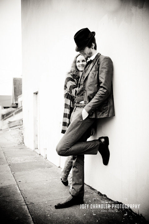 Couple leaning up against a wall in San Francisco's Richmond District
