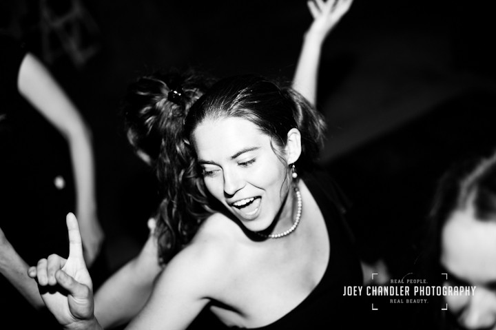 Young Woman dancing and laughing at wedding in San Francisco