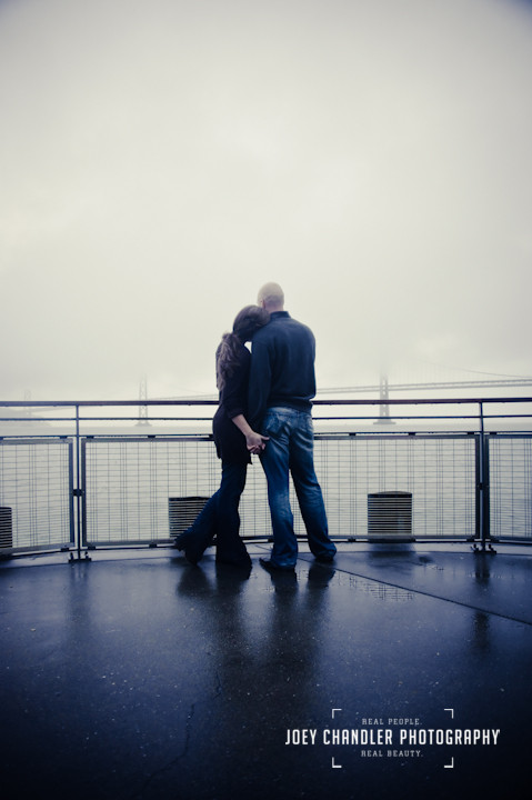 Couple looking at the San Francisco fog at the Ferry Building