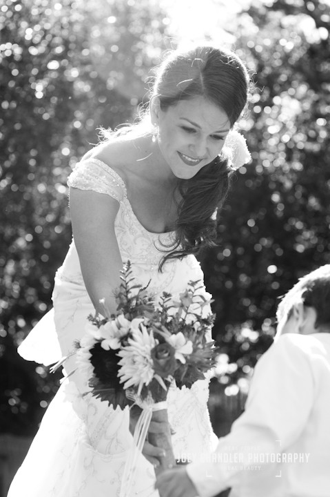 Gourgeous Bride handing flowers to boy San Francisco Wedding Photographer