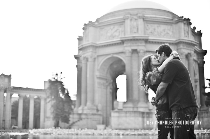 Couple hugging and kissing at San Francisco's Palace of Fine Arts.