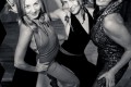 Three ladies in sexy onesies showing off at a Party in San Francisco