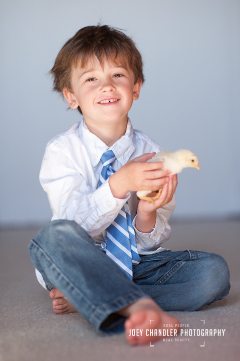A young boy and his chick