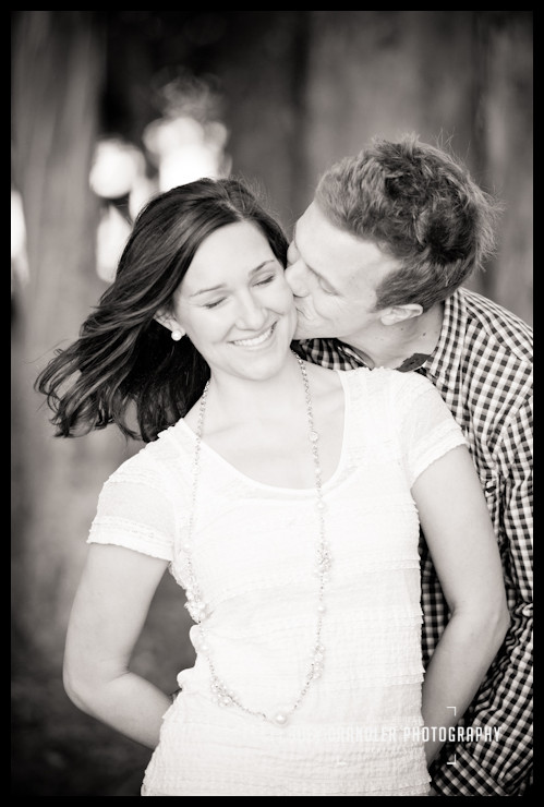Can't tell who is happier Photograph of an engaged couple kissing in San Francisco's Presidio