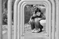 Father and son peering through bike rack at Rob Hill in Presidio- San Francisco Photographer Joey Chandler