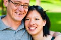 Mother and father hugging in Sutro Heights Park - San Francisco Wedding Photographer Joey Chandler