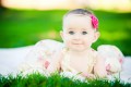 Beautiful Baby lying in the Green Grass of Sutro Heights Park - San Francisco Wedding Photographer Joey Chandler