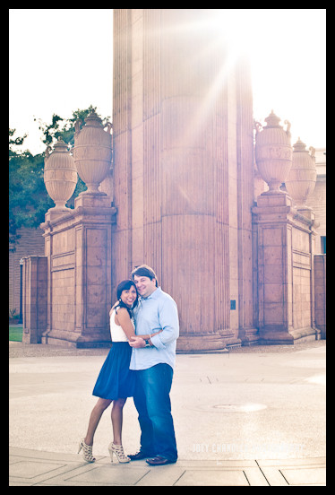 Sun Flare at the Palace of Fine Arts Engaged Couple hugging at Palace of Fine Arts- San Francisco Engagement Photographer Joey Chandler