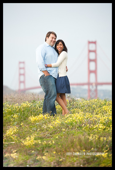 Beautiful Couple. Beautiful Flowers. Beautiful Bridge. Couple standing in flowers with the Golden Gate Bridge- San Francisco Engagement Photographer Joey Chandler