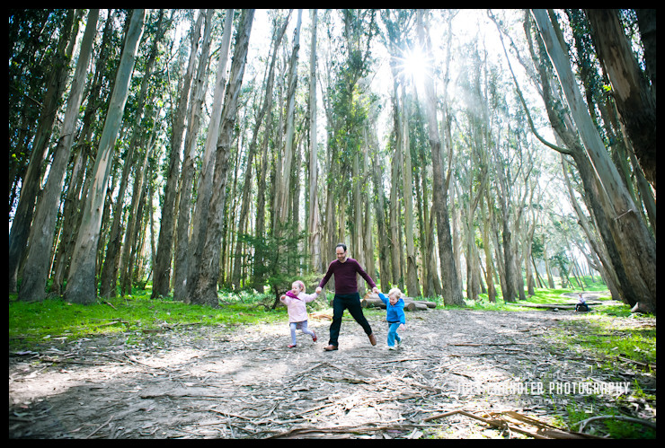 A father and his children running at Lover's Lane in San Francisco