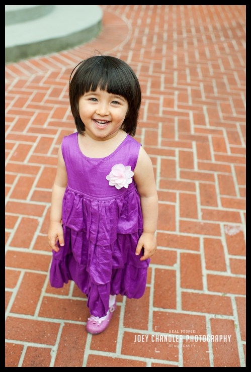 Beautiful Girl in the court yard Smiling Girl standing in a brick court yard - San Francisco Child Photography