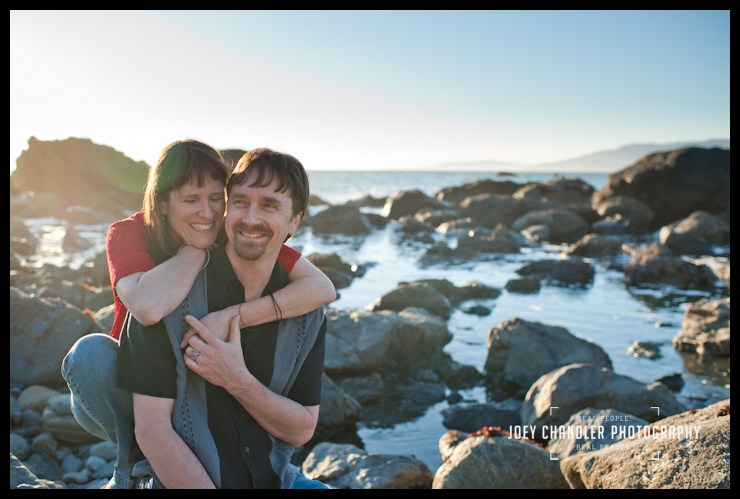 Love along the San Francisco coast Engaged Couple sitting among rocks along San Francisco coast -San Francisco Engagement Photography