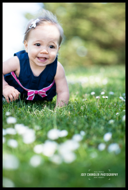 Baby girl crawling in grass at San Francisco Park Baby girl crawling in grass at San Francisco Park
