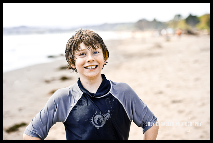 Big smile at the beach Boy smiling on a beach in Aptos for a family photograph