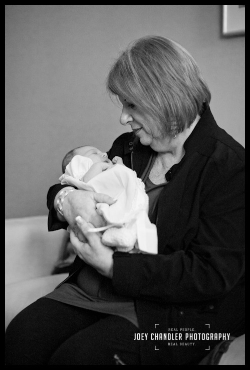 Grandmother and baby girl at San Francisco Naming Ceremony Grandmother holding newborn granddaughter in San Francisco home