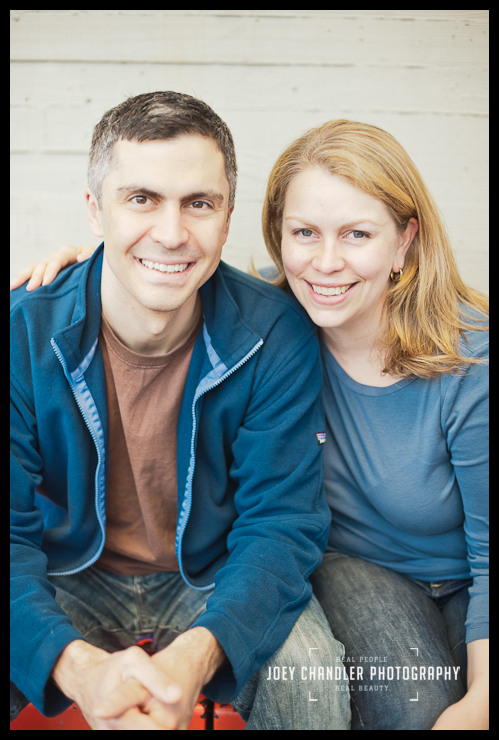 Mom and Dad smiling for family portraits Husband and wife smiling for family portraits at San Francisco Muni Station