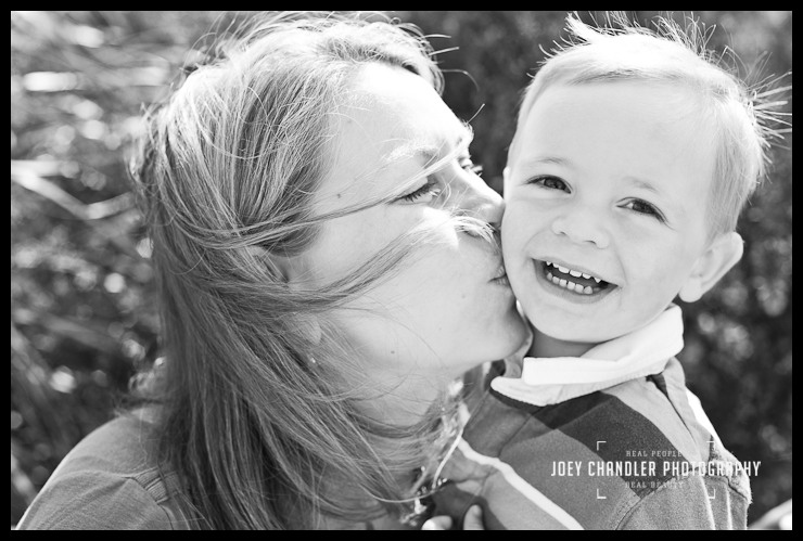 Mom kissing son during San Francisco family portraits Mom kissing son during San Francisco family portraits