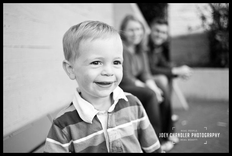 More Smiles at the Muni Station for family portraits Boy smiling with Parents at a Muni Station in San Francisco