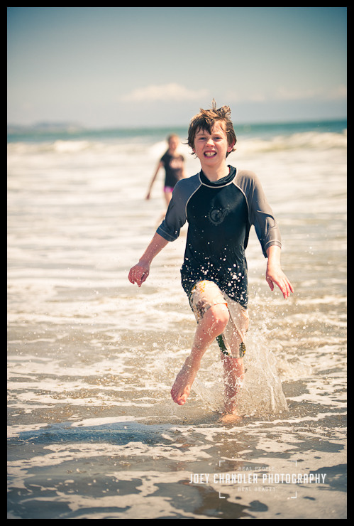 Running at the beach in Aptos Boy running in the water at a Beach in Aptos