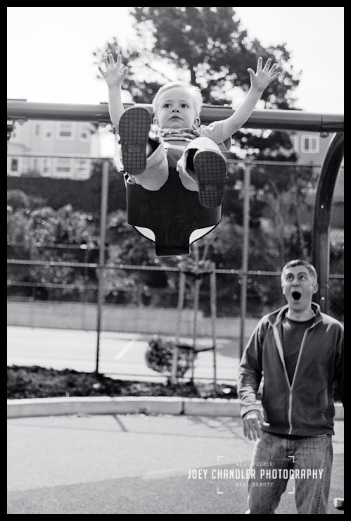 Swing Smiles in San Francisco - Family portraits Father pushing son on swing during Family Portraits in San Francisco