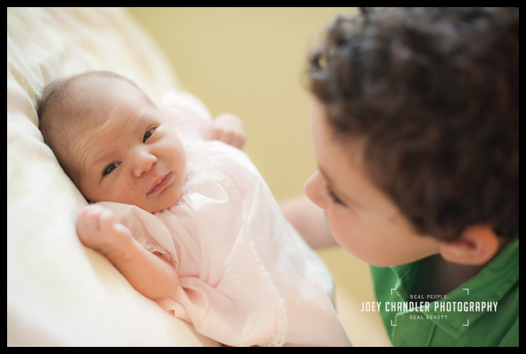 brother and newborn baby sister at San Francisco Naming Ceremony new born girl looking at big brother