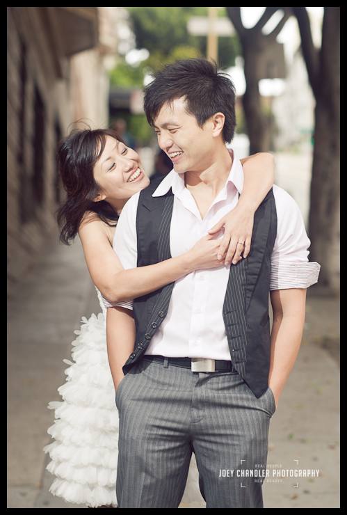 Relaxing after engagement photographs in San Francisco Couple hugging after engagement photographs in San Francisco