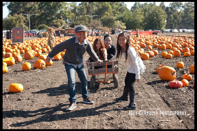 Family of four playing at Perry's Pumpkin Patch