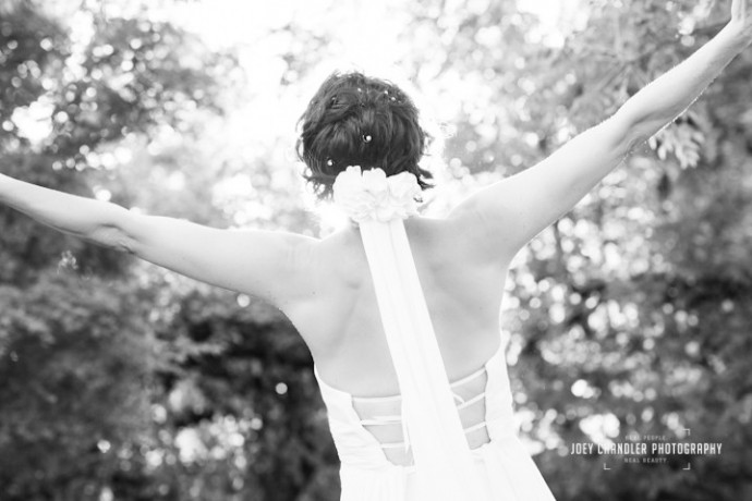 Bride happy with outstretched arms