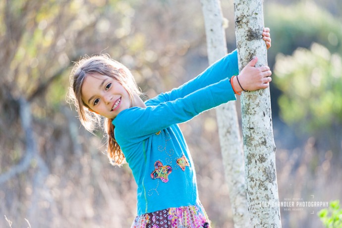 Girl leaning from a tree in a San Rafael Park